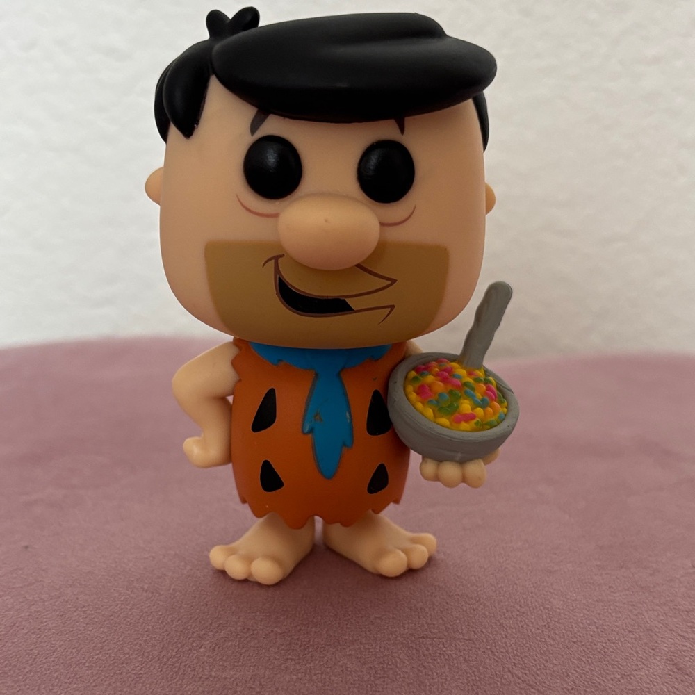 Funko Fred Flintstone with Fruity Pebbles
